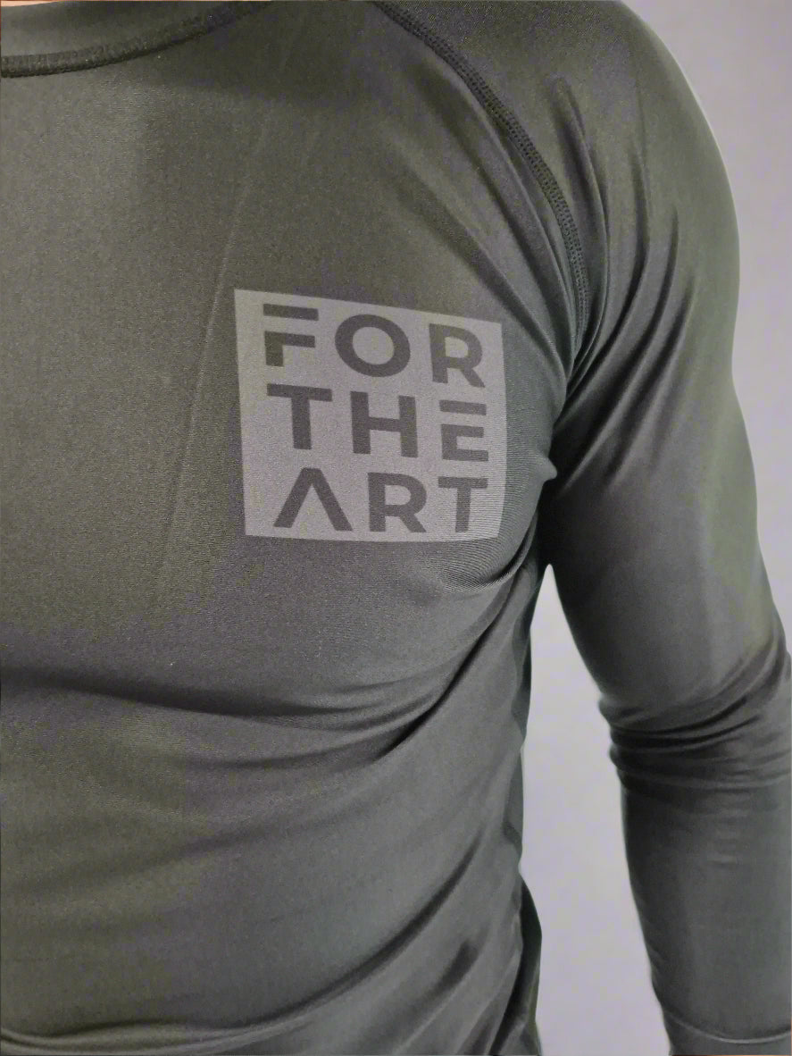 Gray long-sleeve shirt with 'FOR THE ART' logo on a white background